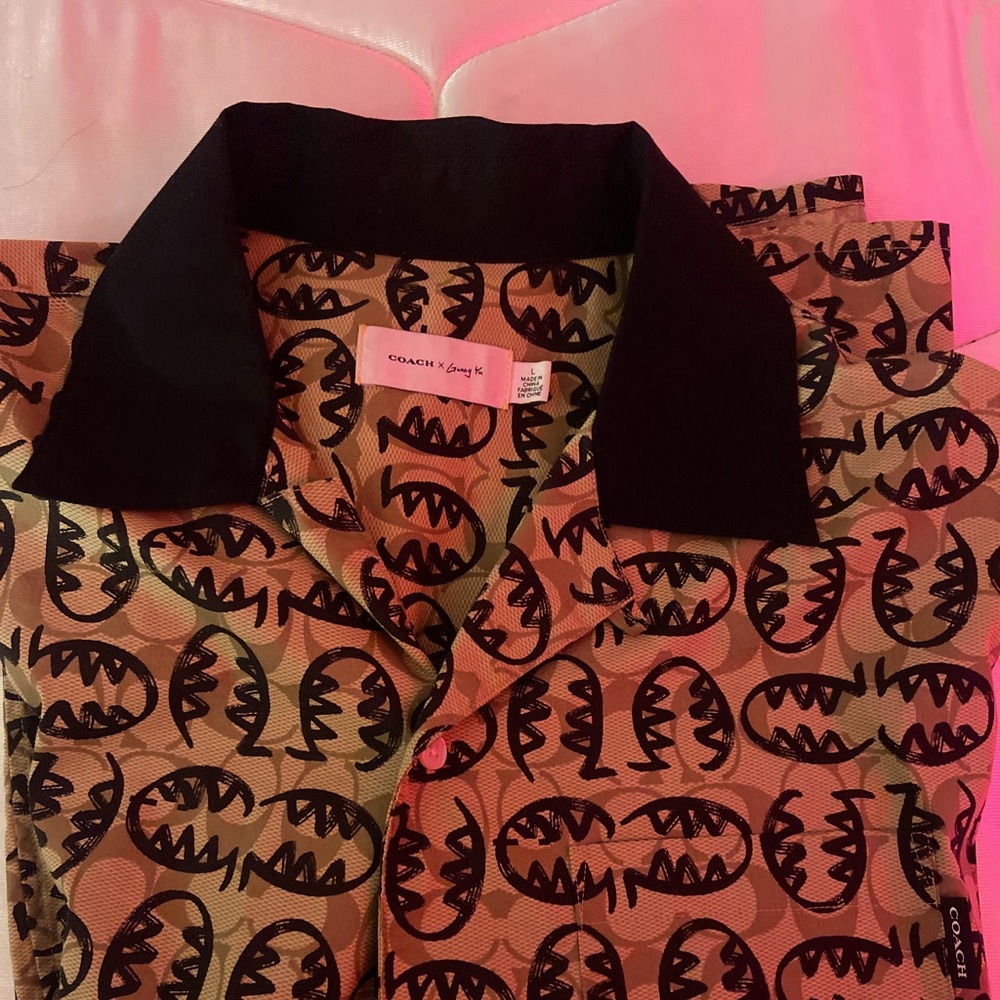 Coach button up shirt gently worn.Very loud branding on the shirt.